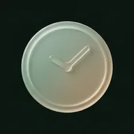 A frosted glass wall clock with no numerals